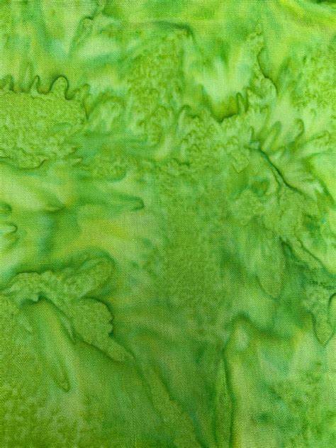 that green batik fabric The price indicated is for 25cm. Multiple quantities will be cut as one continuous piece